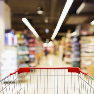 1683619409_Canva___blur_supermarket_aisle_with_empty_red_shopping_cart_background-300x300.jpg